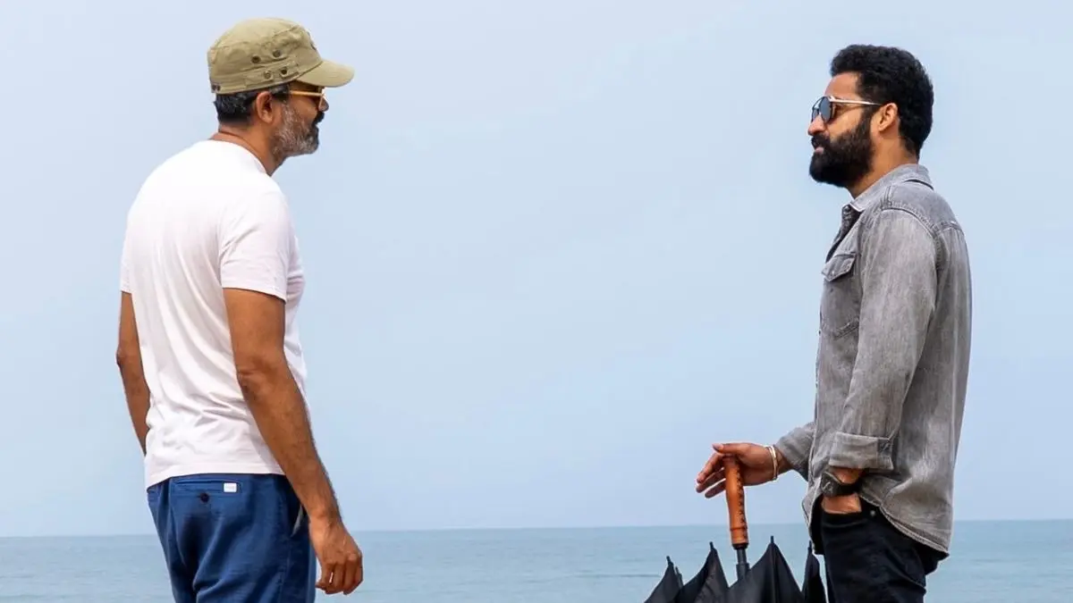 Jr NTR and Prashanth Neel standing together.