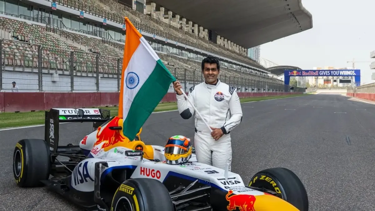 Karun Chandhok Hails 'Special Day' After Driving Sebastian Vettel's Red Bull R8 At Buddh International Circuit Karun Chandok with Sebastian Vettel's red Bull R8