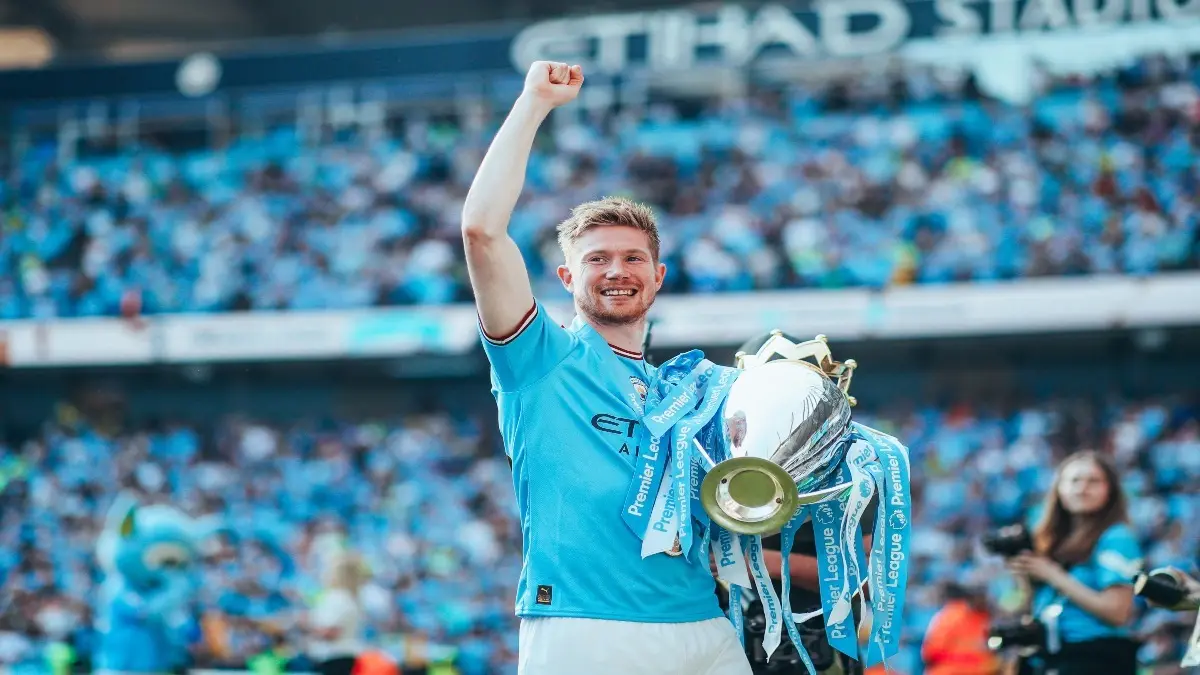 Explained: How Kevin De Bruyne Can Still Continue To Play For Manchester City This Season Despite Contract Expiry Kevin De Bruyne with the Premier League trophy