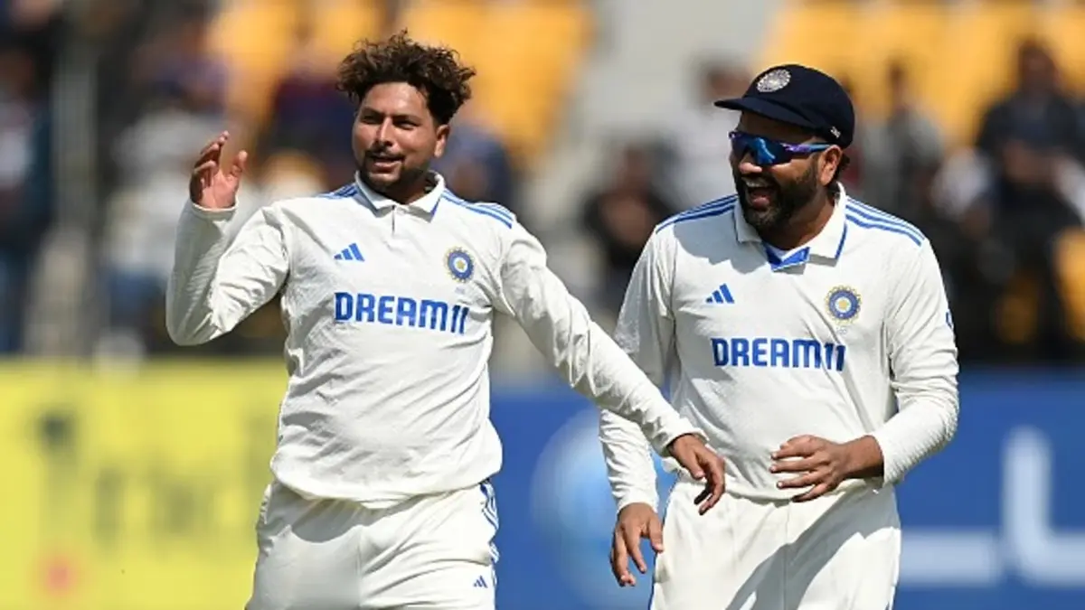 Kuldeep celebrates a wicket with Rohit
