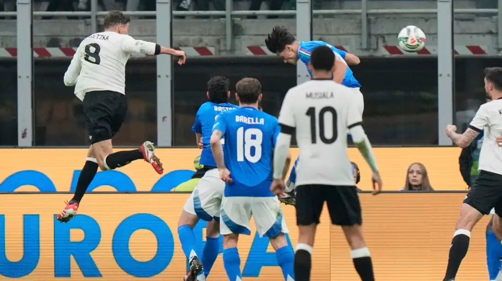 Leon Goretzka scores Germany's second goal during the UEFA Nations League quarterfinal first leg against Italy.