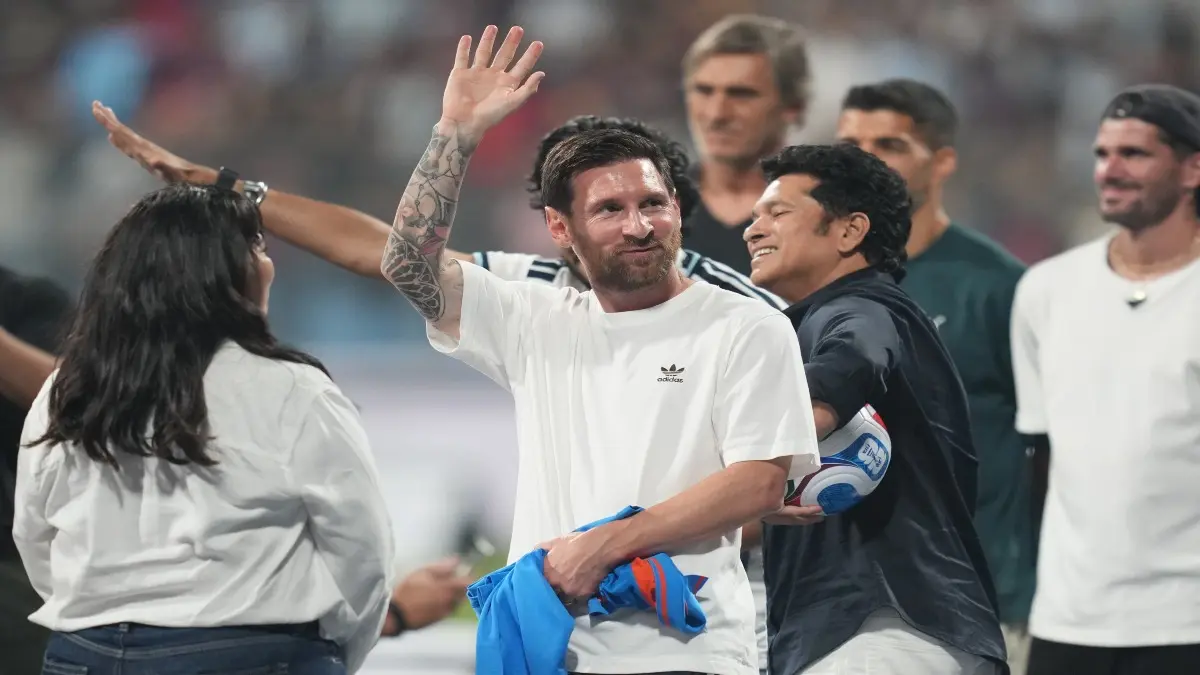 Lionel Messi waves to the crowd in Mumbai