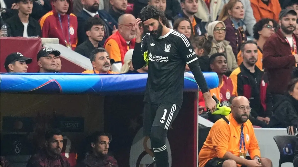 Premier League: Alisson To Miss Manchester United Game? Liverpool Manager Arne Slot Reveals Injury Timeline Liverpool goalkeeper Alisson Becker walks near the sideline after being substituted off during Galatasaray clash