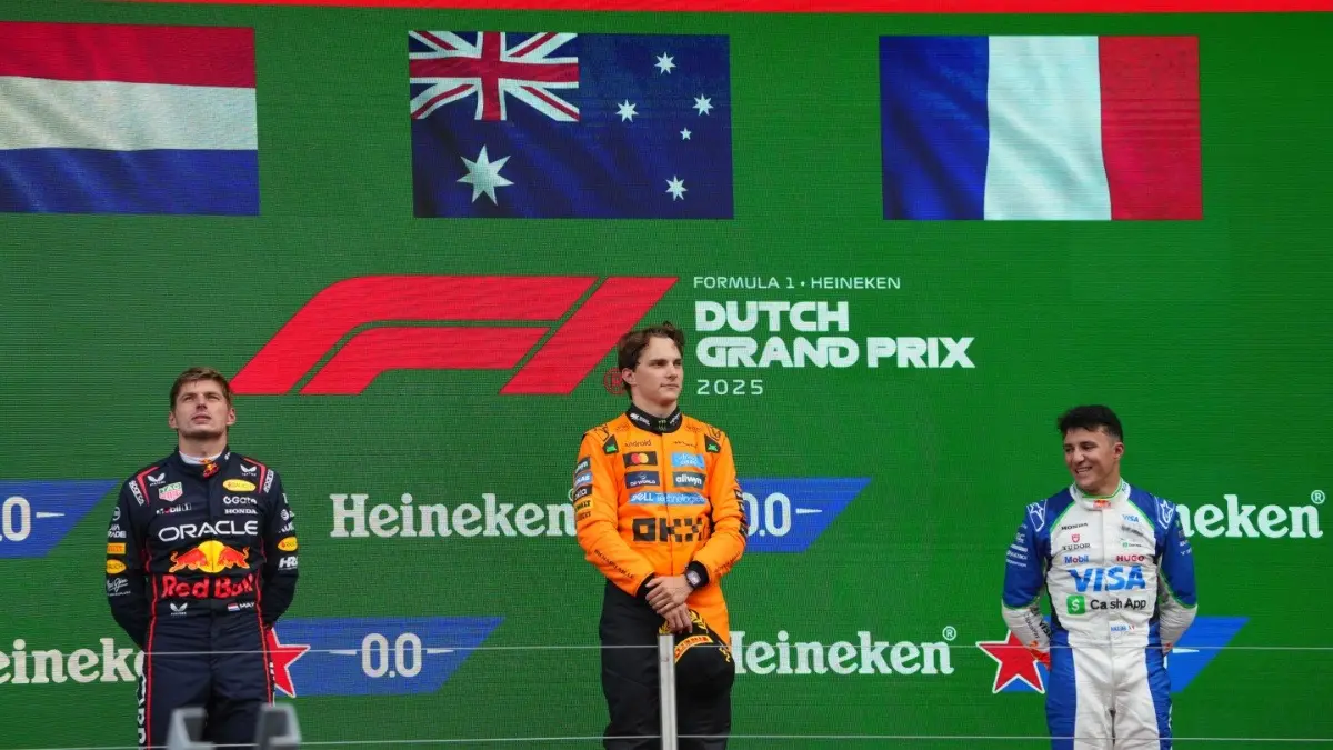 Max Verstappen, Oscar Piastri, and Isack Hadjar on the podium at the Dutch GP