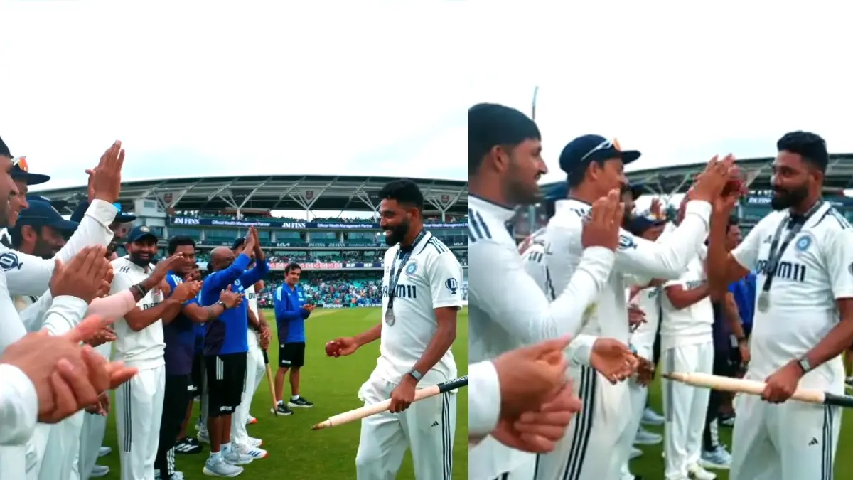 Members of the Indian cricket team applaud Mohammed Siraj