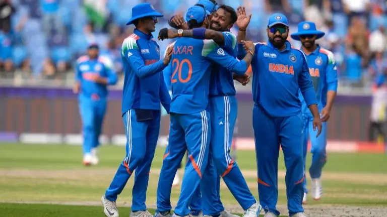 Members of the Indian cricket team celebrate the fall of Pakistan's wicket