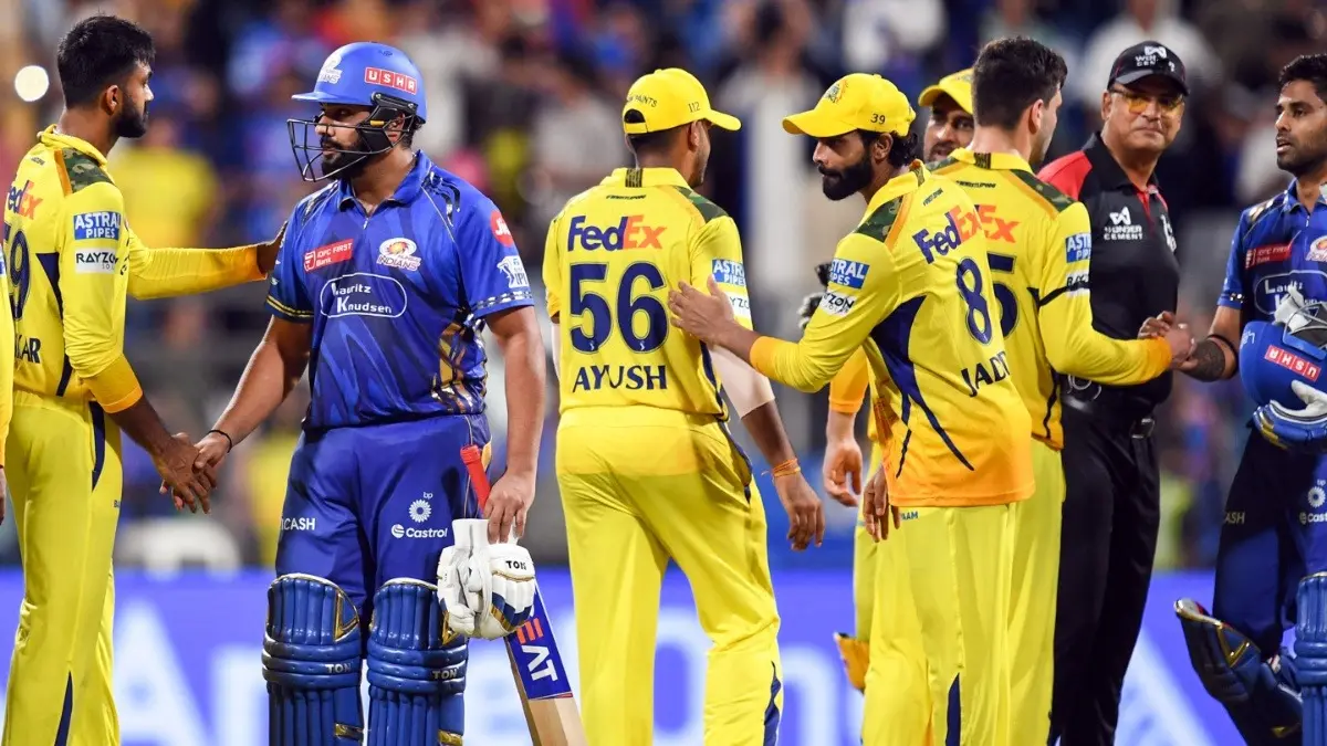 MI and CSK players exchange handshakes after the IPL 2025 match