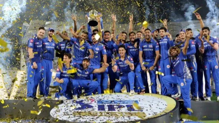Mumbai Indians players pose with IPL trophy