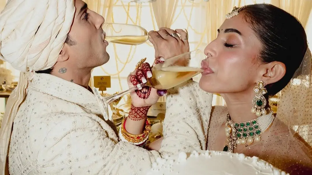 Prateik Babbar’s Family Feud Explained: From Snubbing Father, Brother At His Wedding To Adopting Late Mother's Name Newlyweds Prateik and Priya sip champagne in images from wedding day.