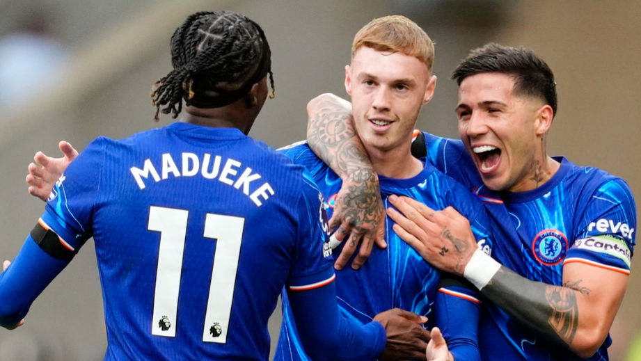 Noni Madueke and Cole Palmer celebrate scoring for Chelsea.