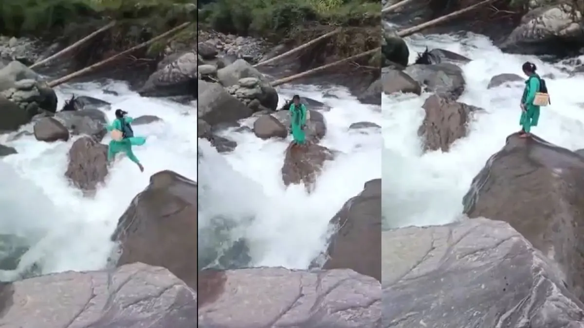 Nurse Crosses flooded stream