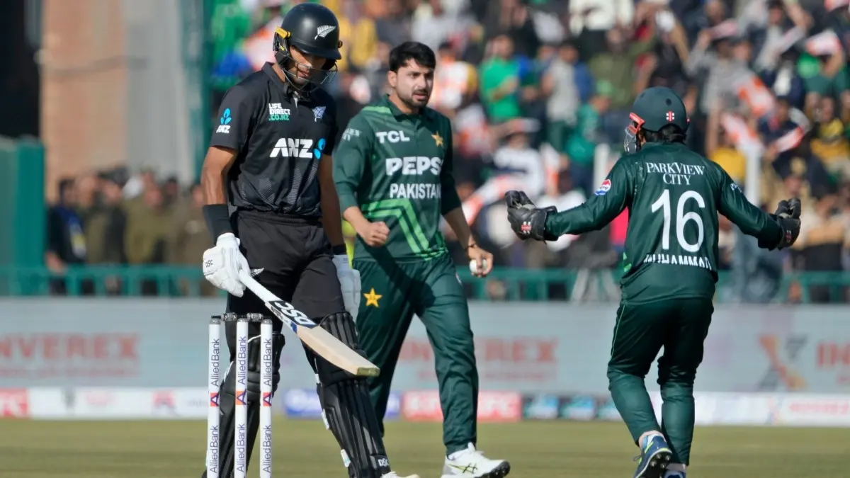 Pakistan's Abrar Ahmed celebrates the fall of Rachin Ravindra's wicket
