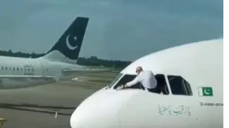 pakistani pilot cleaning plane window
