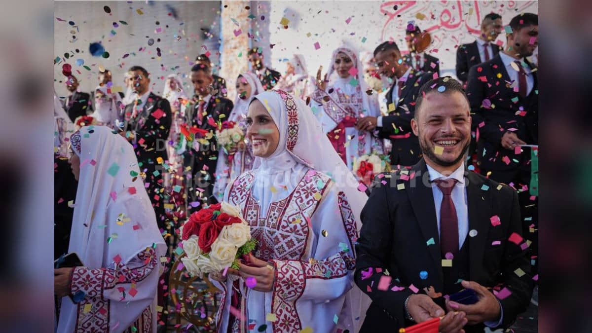 Palestinian couples participate in a mass wedding ceremony in Hamad City in Khan Younis, Gaza Strip.