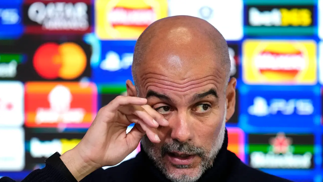 Pep Guardiola attends a press conference
