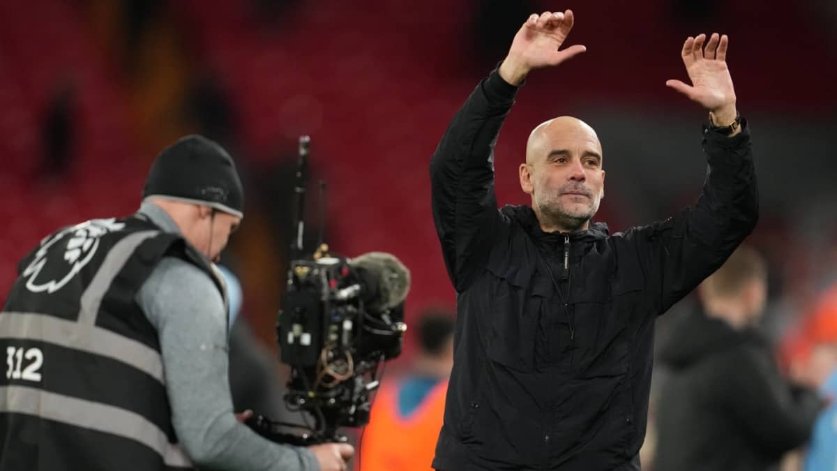 Pep Guardiola reacts after Manchester City defeat Liverpool