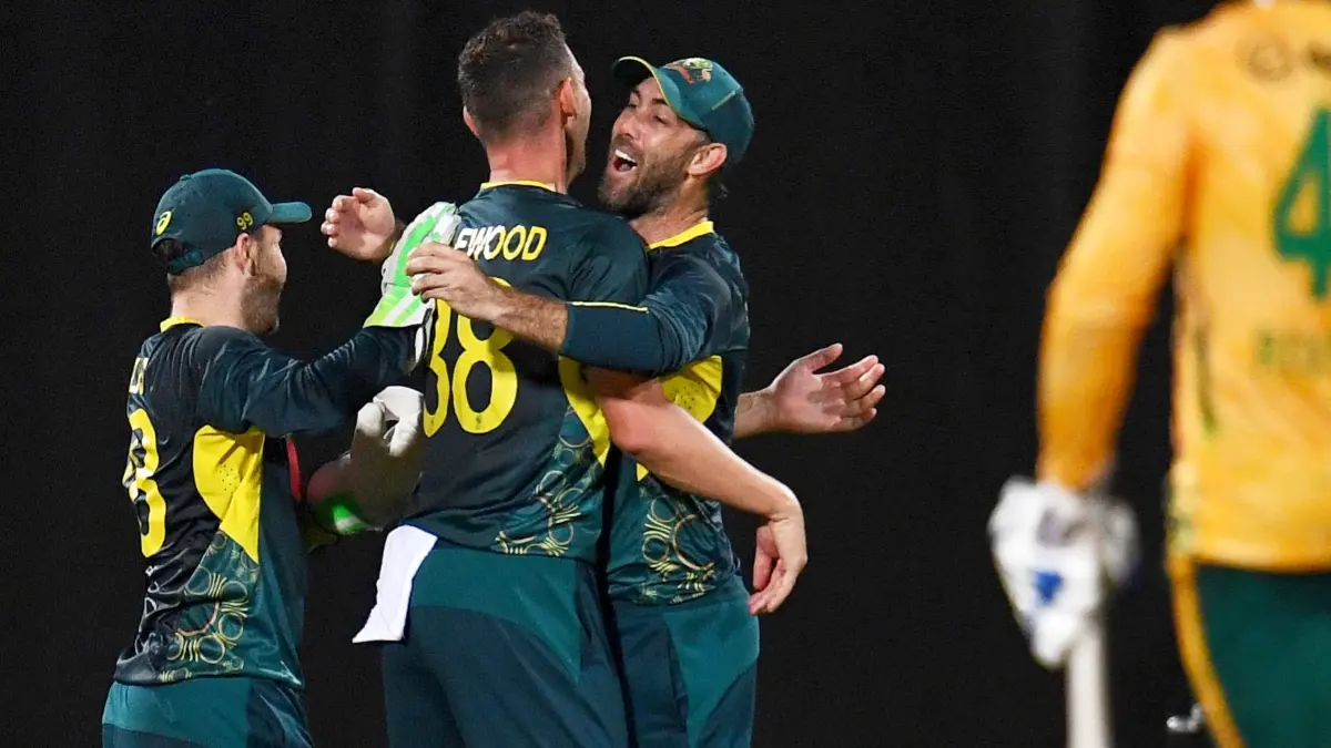 Players of Australian team celebrate fall of a wicket