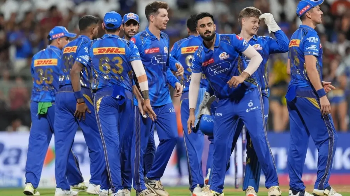 Players of Mumbai Indians celebrate a fall of wicket during IPL 2025