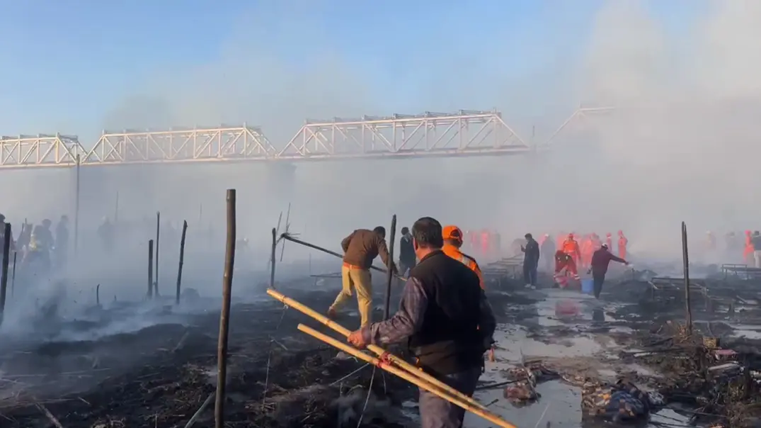 Police and SDRF personnel carry out dousing operations after a fire broke out at the ongoing Maha Kumbh Mela