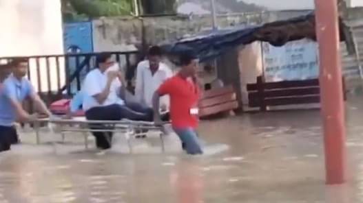 Video Of Shahjahanpur Medical College Staffers Carrying Principal Avoiding Flooded Roads Goes Viral