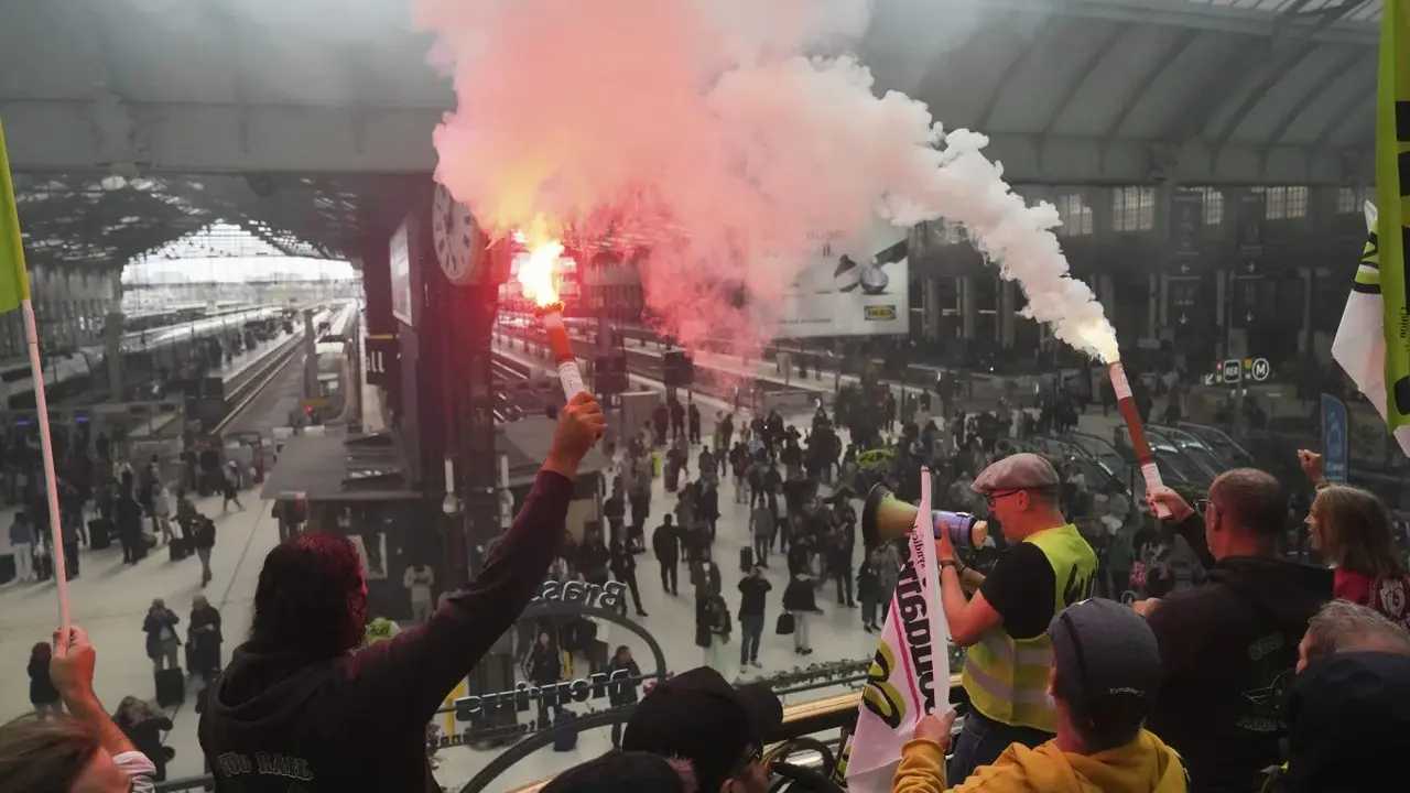France Gets New PM As 'Block Everything' Protests Rage; 250 Arrested Railway workers hold smoke bombs in the Gare de Lyon train station during the 'Block Everything' protest movement in Paris on Wednesday.
