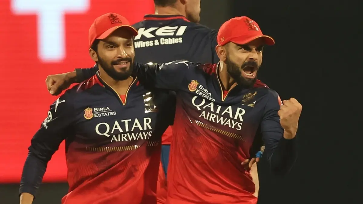 Rajat Patidar and Virat Kohli celebrate a fall of wicket during IPL 2025