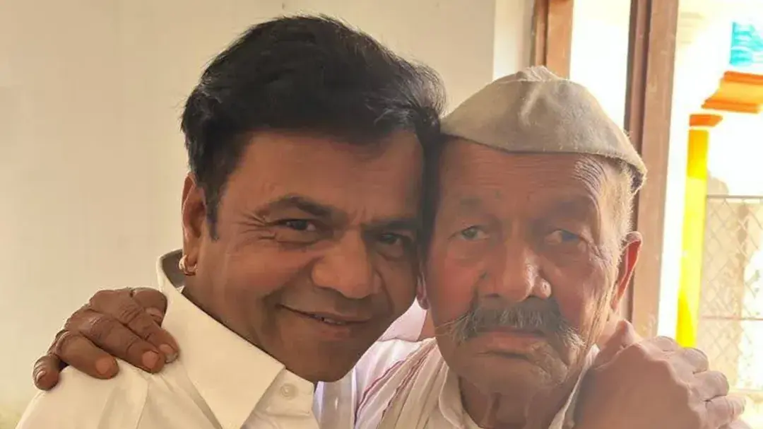 Rajpal Yadav poses with his father.