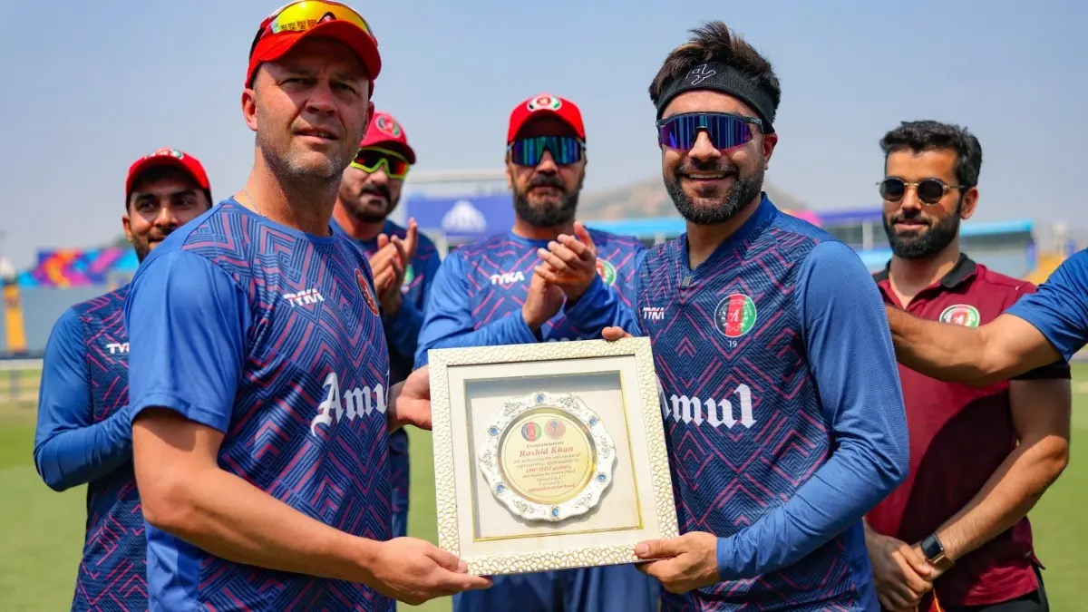 Rashid Khan Honours Jonathan Trott's Contribution To Afghanistan Cricket Ahead Of His Last Match As Head Coach: 'He Has Worked So Hard' Rashid Khan being felicitated with a special shield from head coach Jonathan Trott in 2023