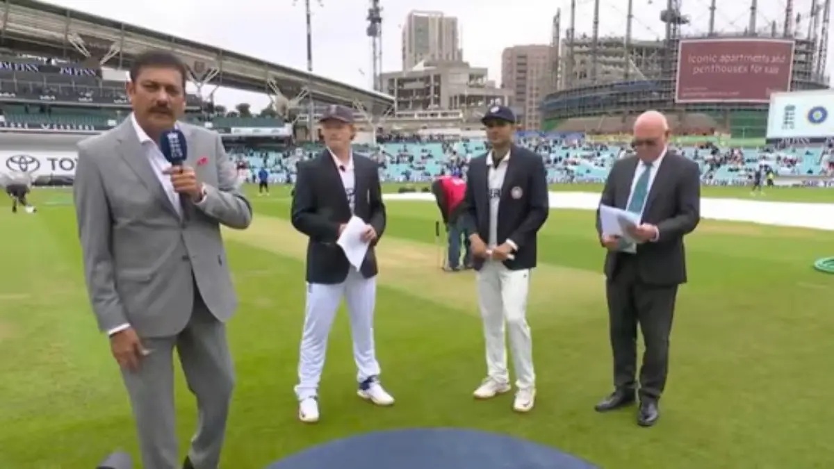 Ravi Shastri with the two captains at the toss at Oval