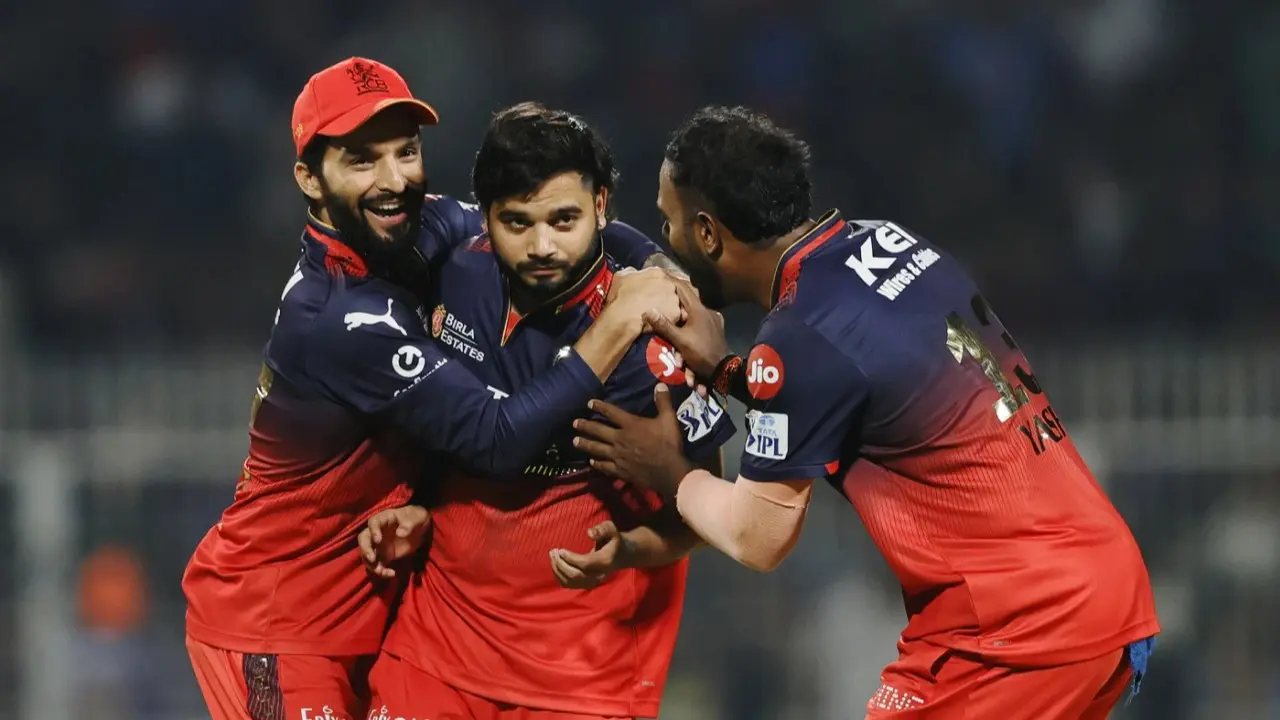 RCB players celebrate around Suyash Sharma