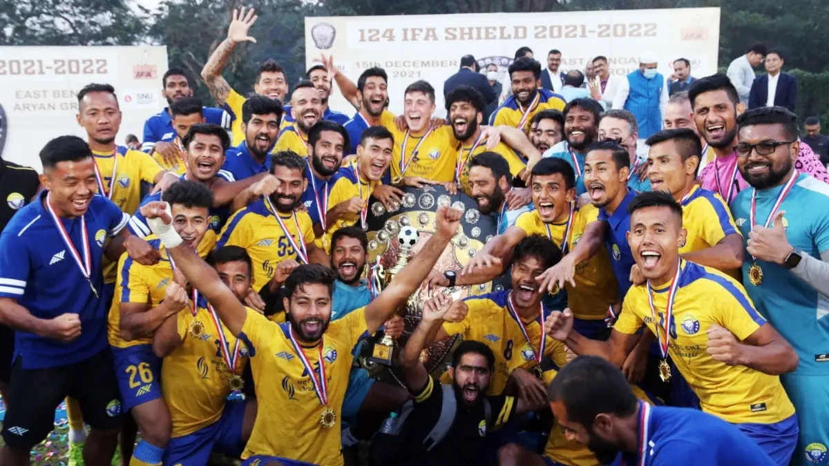 Real Kashmir FC players celebrate after winning the 124th IFA Shield final in 2021
