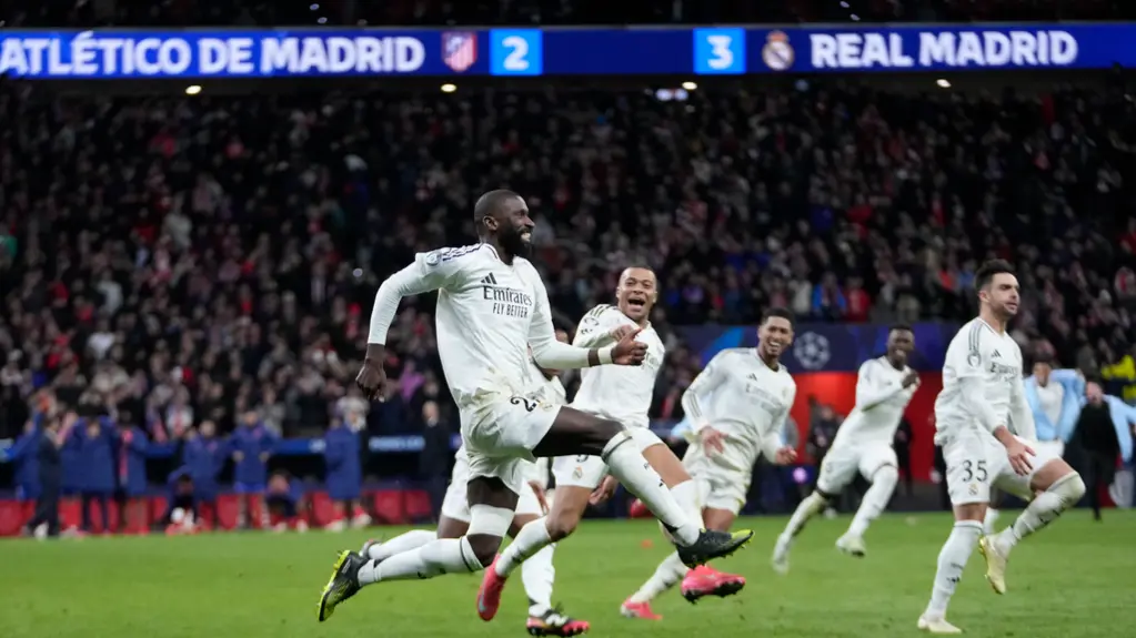 Real Madrid players celebrate after winning the penalty shootout during the Champions League Round of 16, second leg at Metropolitano Stadium.