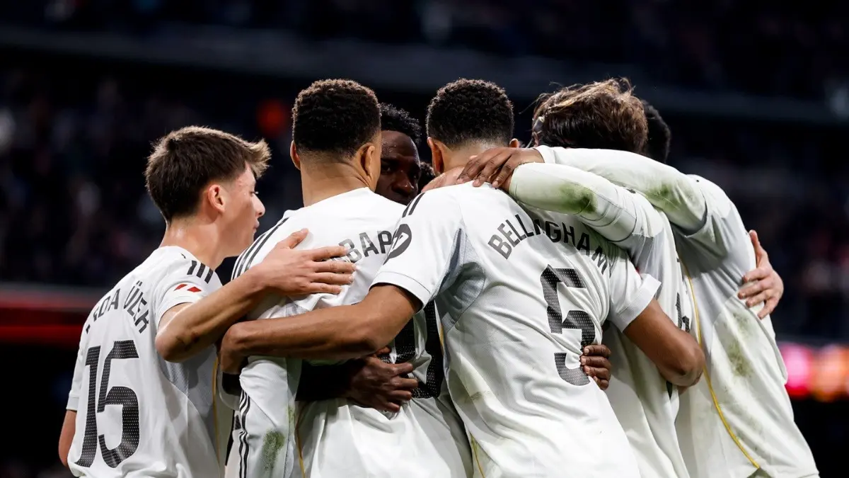 Real Madrid players celebrating after scoring a goal
