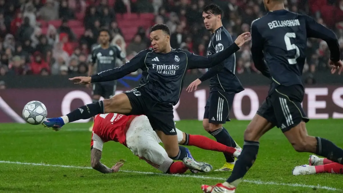Real Madrid Refocuse On La Liga After Stunning Loss To Benfica In Champions League Real Madrid's Kylian Mbappe battles for a ball