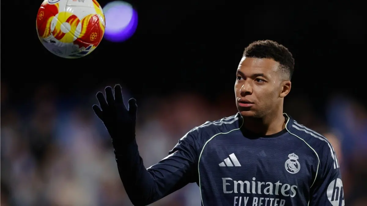 Real Madrid's Kylian Mbappe holds a ball during the Copa del Rey match against Talavera