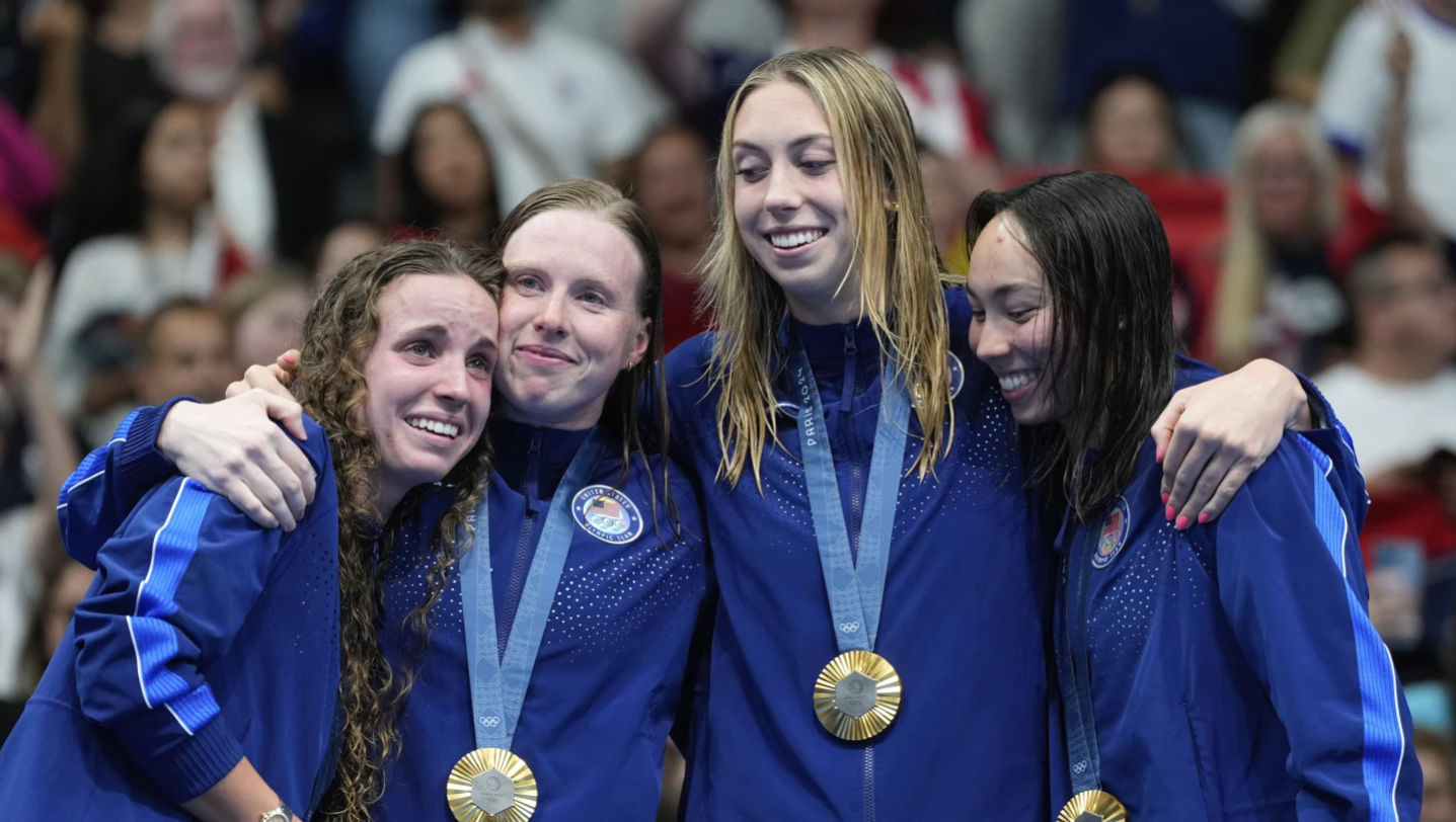 On a wild final night of swimming, U.S. sets two world records, edges ...