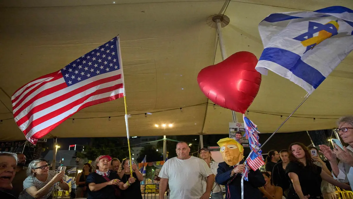 Relatives and supporters of Israeli hostages held by Hamas in the Gaza Strip celebrate after the announcement that Israel and Hamas have agreed to the first phase of a peace plan, as they gather at a plaza known as the hostages square in Tel Aviv, Israel, Thursday.
