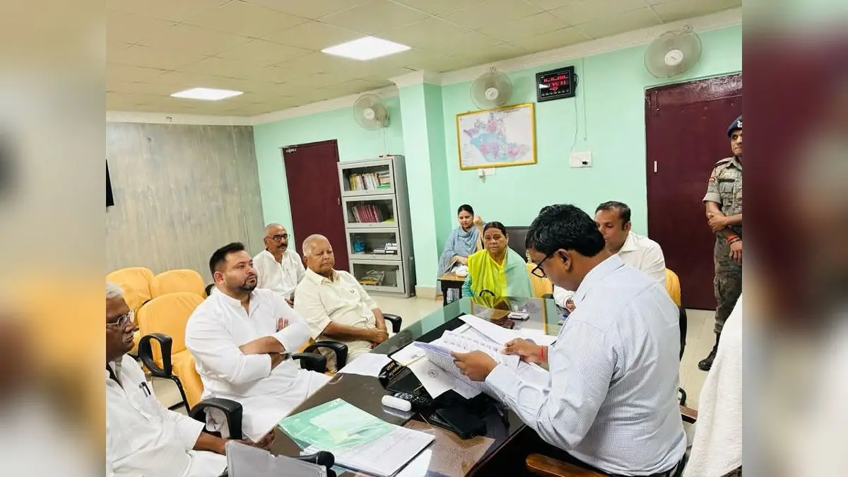 RJD leader Tejashwi Yadav files his nomination from Raghopur Assembly constituency in Bihar as his parents and former CMs Lalu Prasad and Rabri Devi look on.