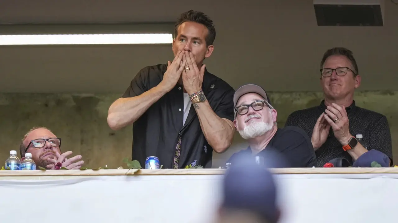 Ryan Reynolds watching his team Wrexham in action
