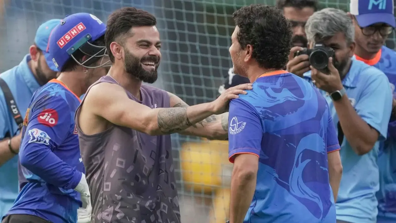 Sachin Tendulkar shares a light moment with Virat Kohli