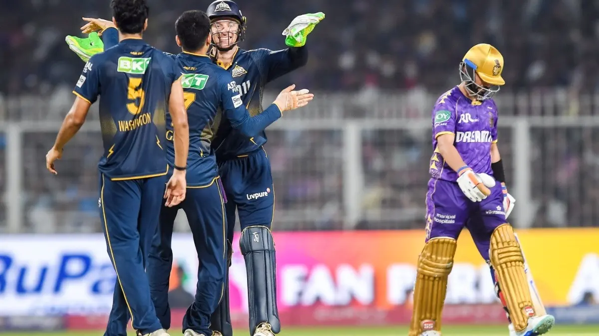 Shubman Gill, Jos Buttler, and Washington Sundar celebrate the wicket of KKR's Ajinkya Rahane