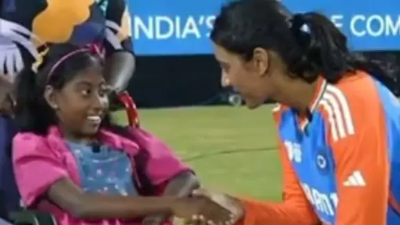 Smriti Mandhana gifts mobile phone to wheelchair-bound girl.