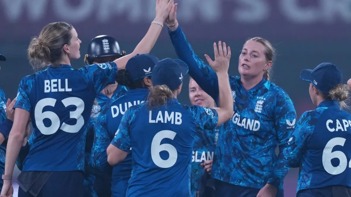 Sophie Ecclestone celebrating after taking a wicket with her teammates at Women's World Cup 2025