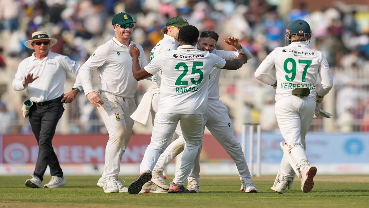 South African players celebrate after beating India