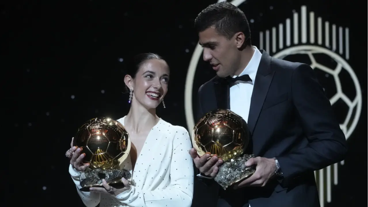 Spanish midfielders Rodri and Aitana Bonmatí with the Ballon d’Or award