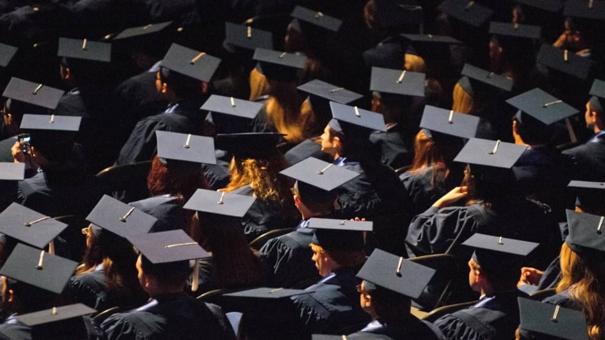Students attend commencement ceremonies in the State Farm Center at the University of Illinois in Champaign, Ill., on Sunday, May 12, 2013.