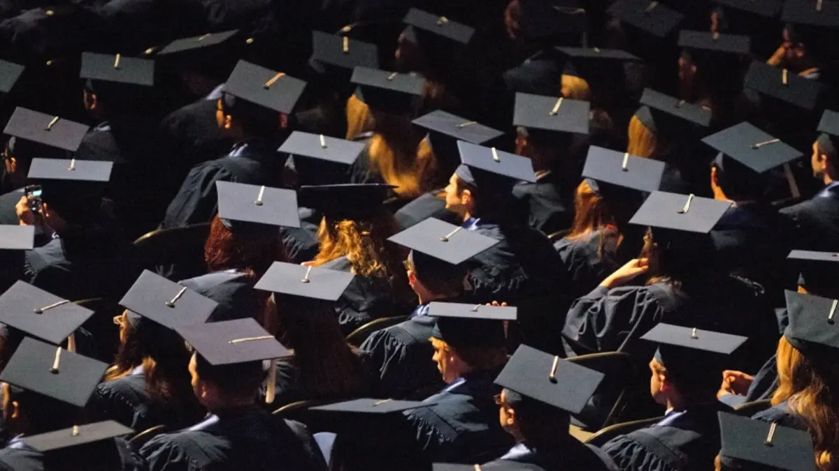 Students attend commencement ceremonies in the State Farm Center at the University of Illinois in Champaign, Ill., on Sunday, May 12, 2013.