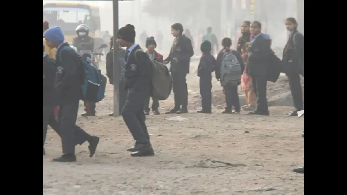 Students walking in foggy weather as Noida schools shut due to cold wave