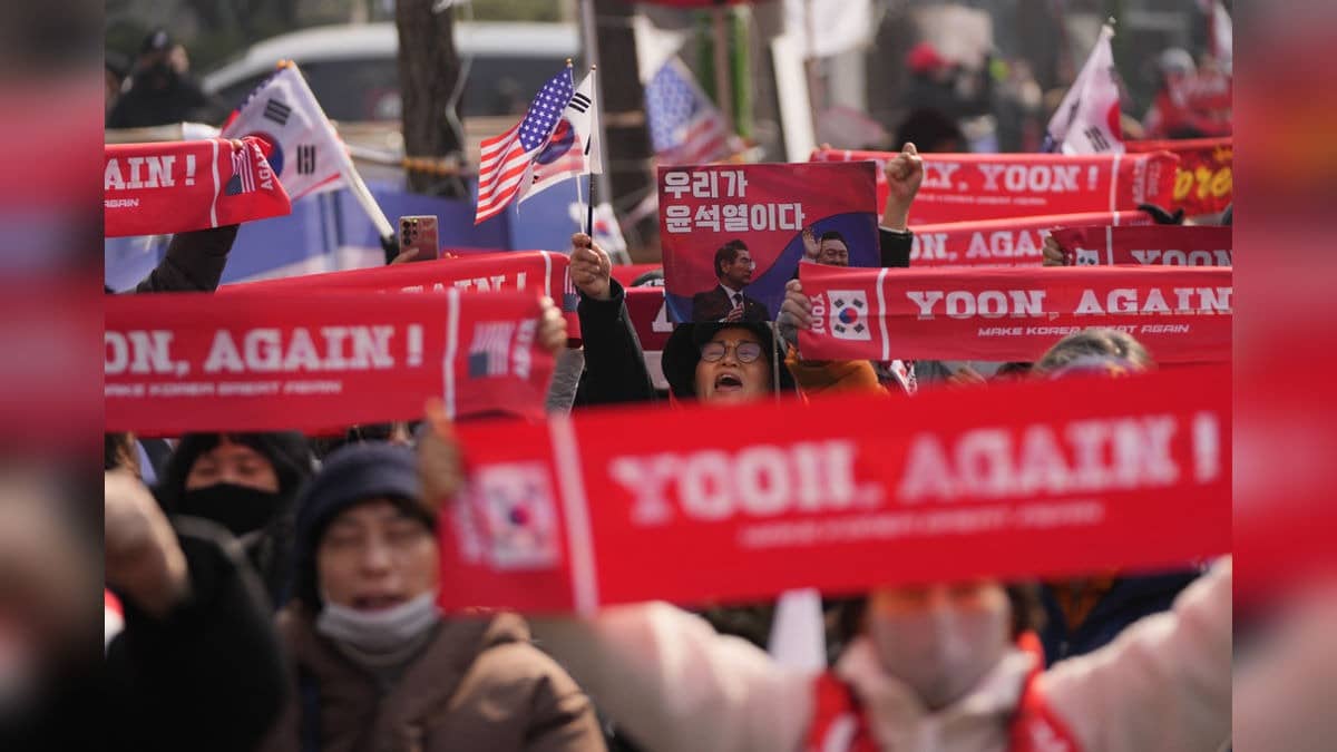 Supporters of former South Korean President Yoon Suk Yeol shout slogans outside of Seoul Central District Court in Seoul, South Korea, Friday.