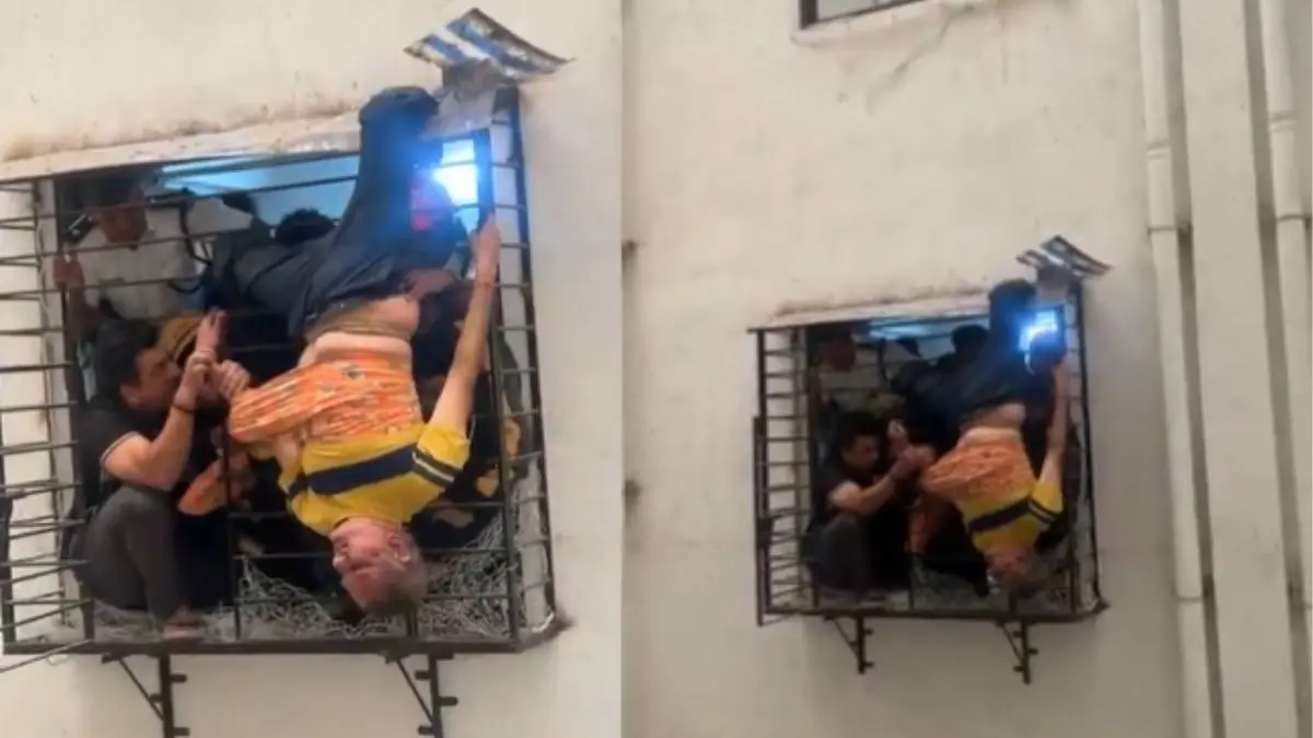 surat man falls from 10th floor and stuck on 8th floor window